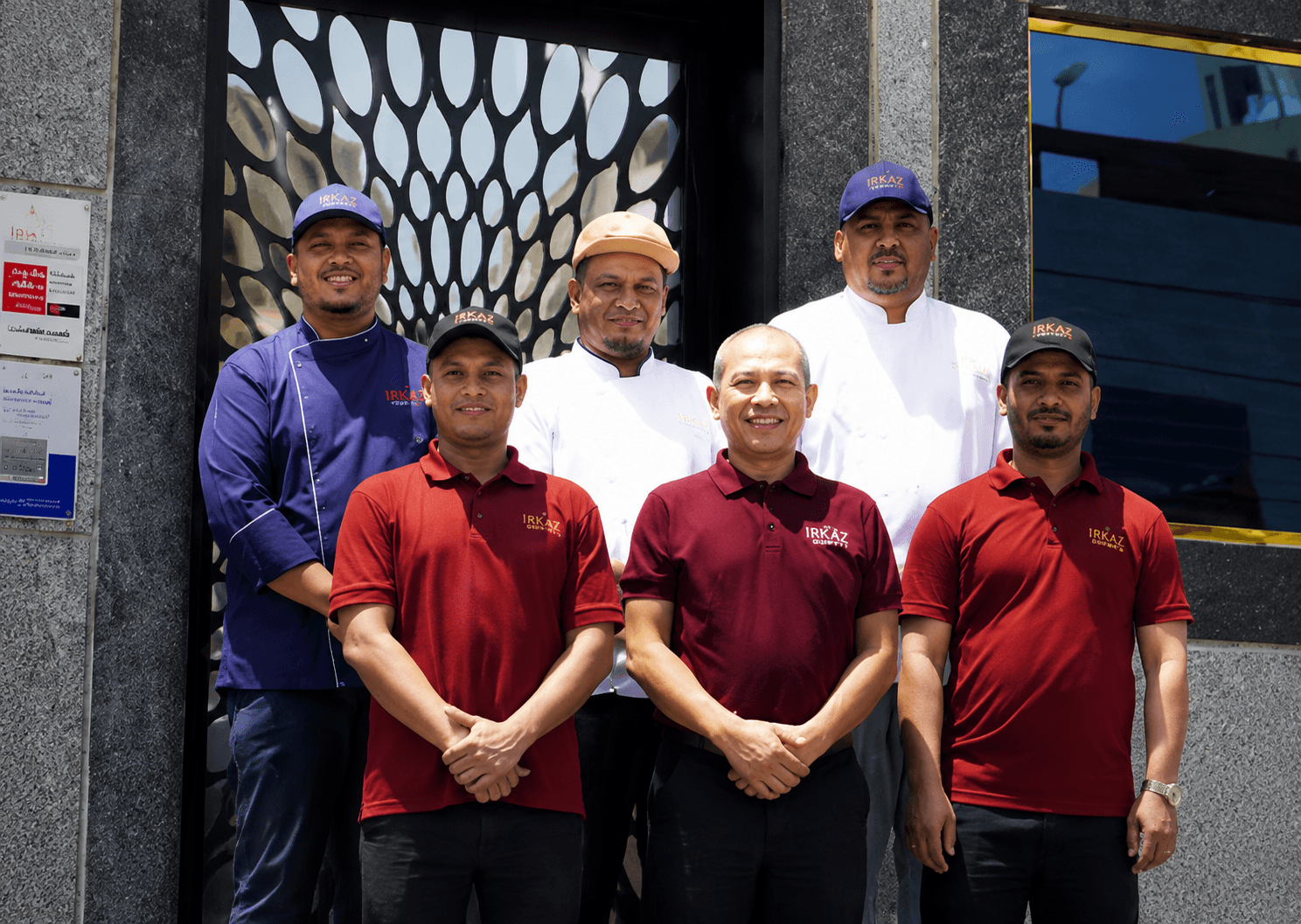 The Irkaz Gourmet team standing outside the Makkah central kitchen facility